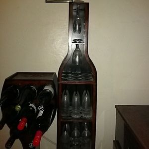 Copper wine rack with wime and glasses